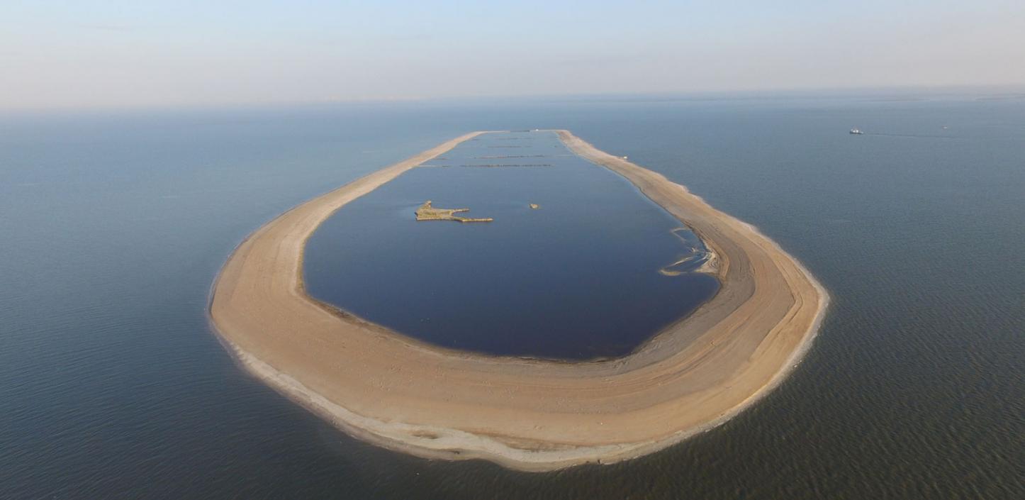 This sand berm built around the eroded remains of a barrier island off Mississippi’s coast will be filled with 3 million cubic yards of sand