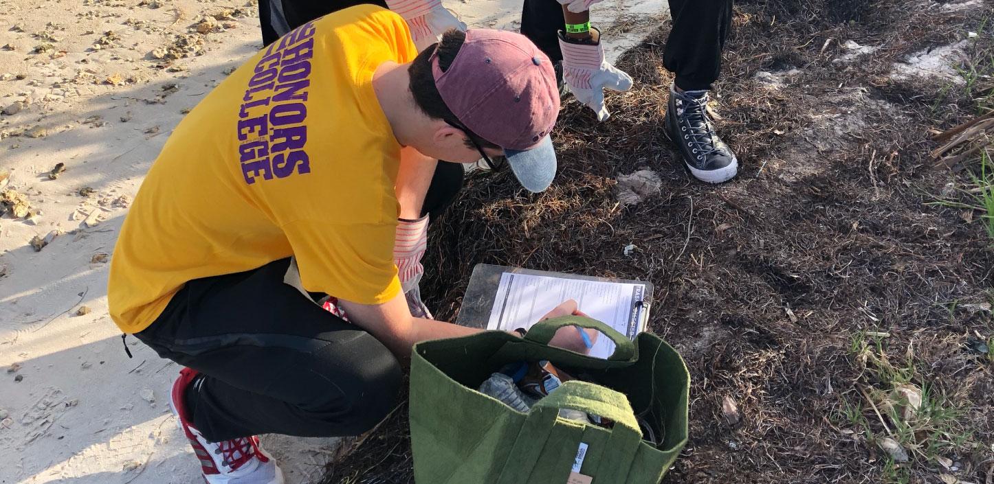 Volunteers record outcomes from beach cleanups in Miami as part of a project supported by the Resilient Communities program.