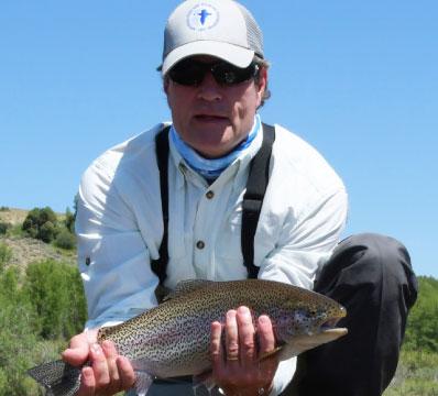 NFWF board chairman holding a fish