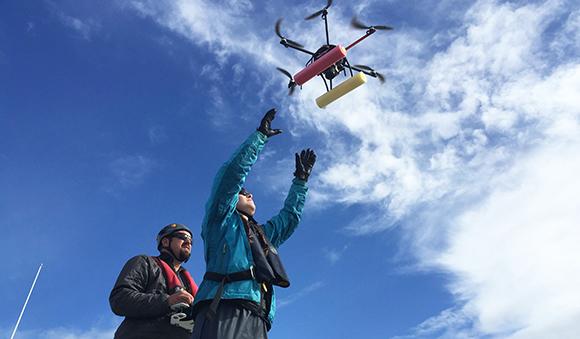 John Durban and Holly Fearnbach of NOAA’s Southwest Fisheries Science Center bring the hexacopter in for a landing