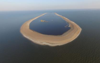 This sand berm built around the eroded remains of a barrier island off Mississippi’s coast will be filled with 3 million cubic yards of sand