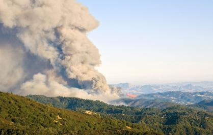 Smoke billows from a California wildfire