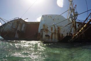 Derelict vessel on coral reef