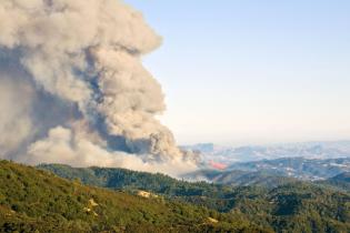 Smoke billows from a California wildfire